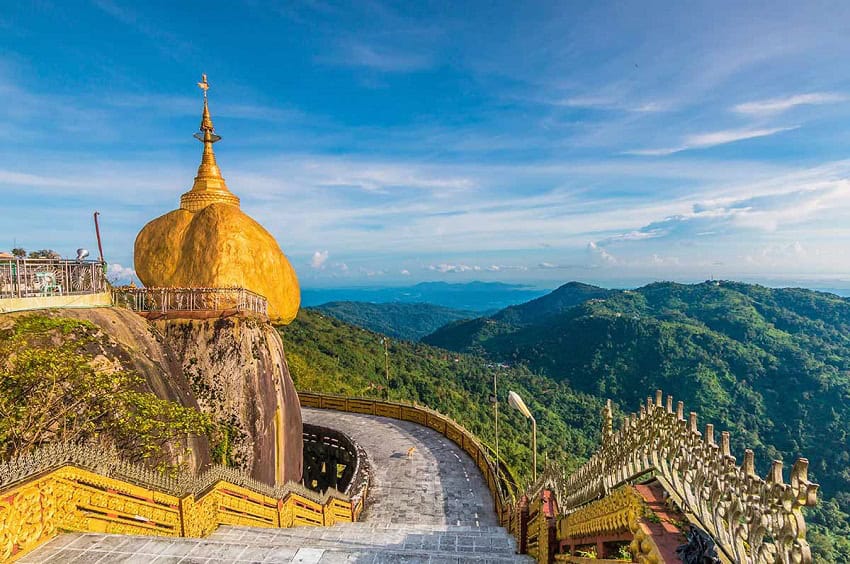 A large golden rock at the summit of the mountain