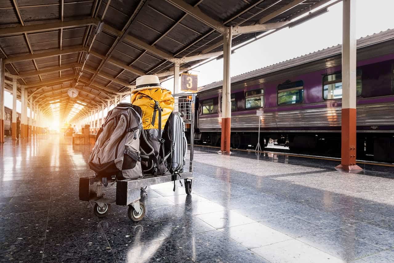 luggage in a train hallway